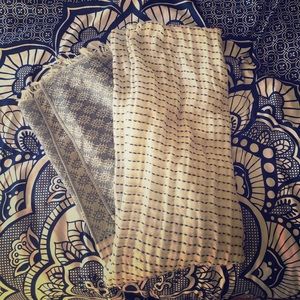 Blue and white patterned blanket scarf.